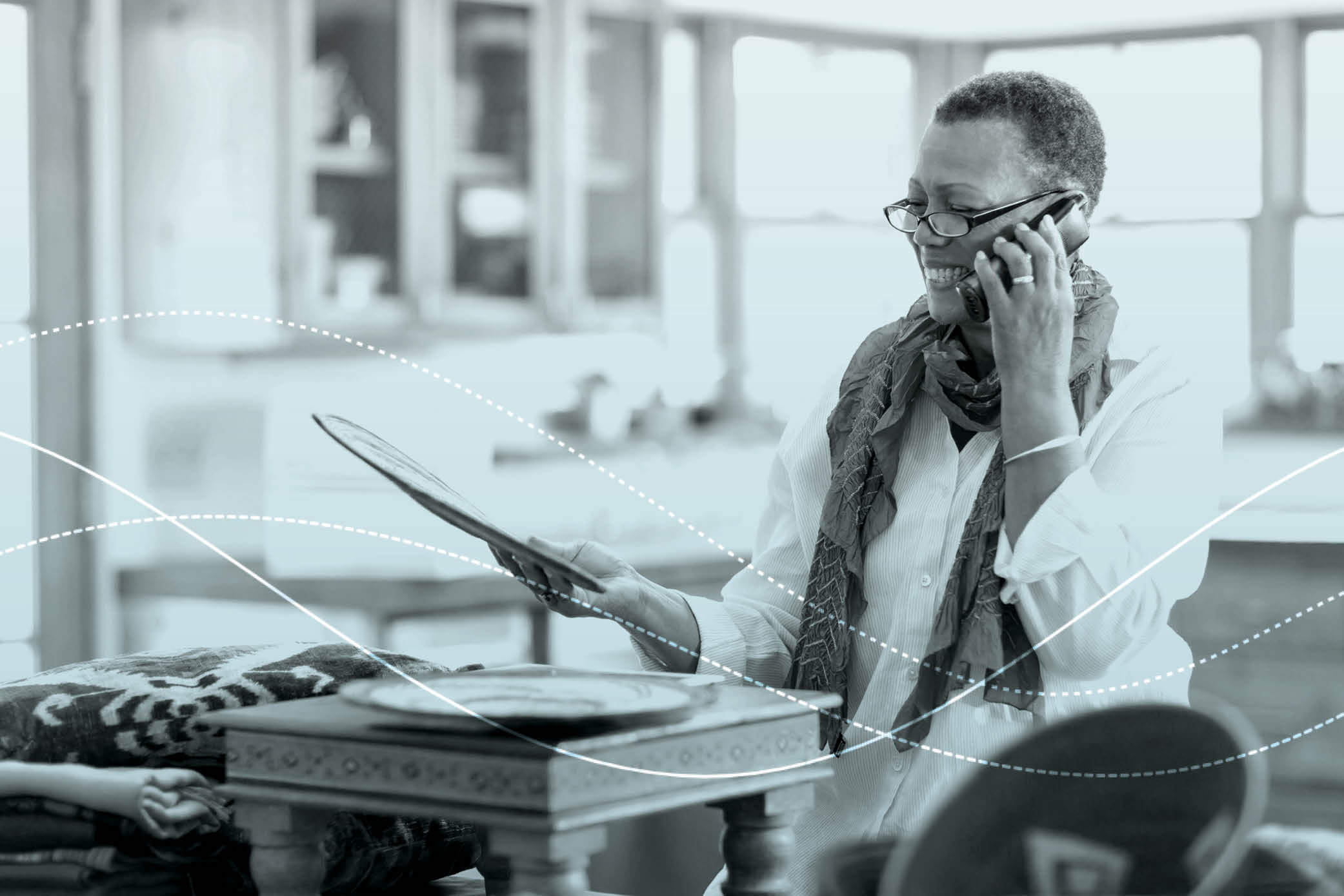 image of women looking at a plate in a store while talking on the phone