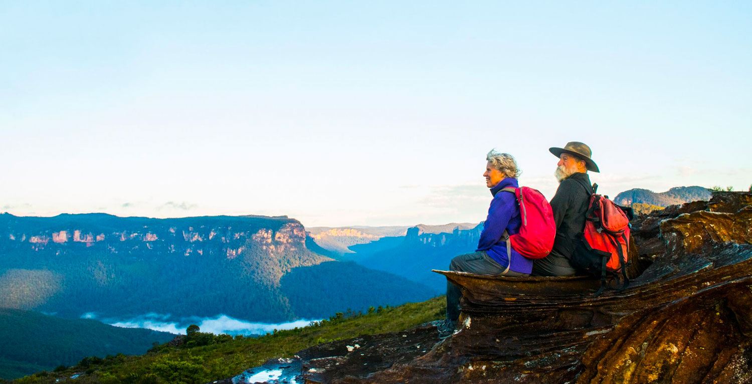 Man and Woman watching over a big vally