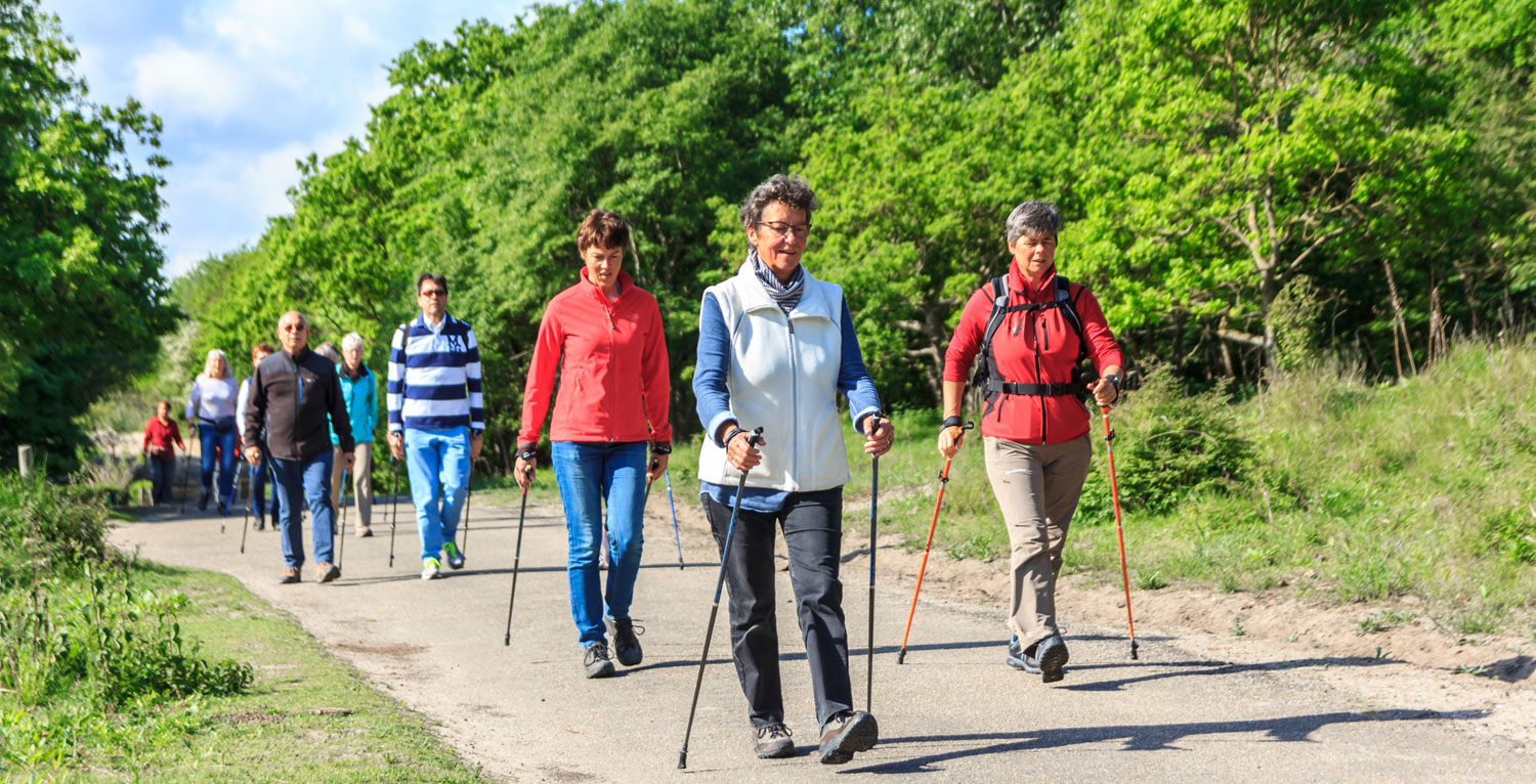 Several older folks taking a hike