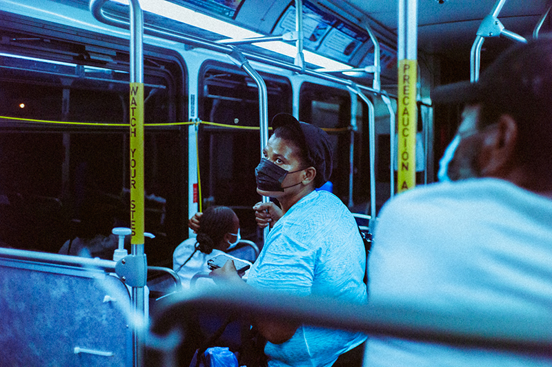 Man on bus wearing mask