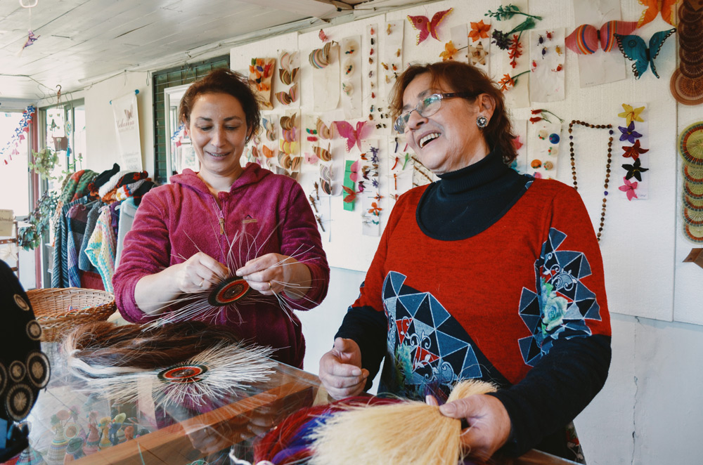 Artisan Milisen Sepúlveda, 38, and her mother Margarita Cabrera, 71, in a room attached to their home where they exhibit and sell their crafts