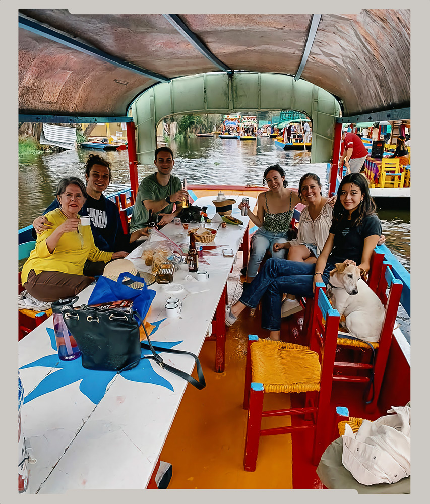 Taking a ride on a trajinera, a small flat bottomed boat, to visit the Floating Gardens in Xochimilco, México City