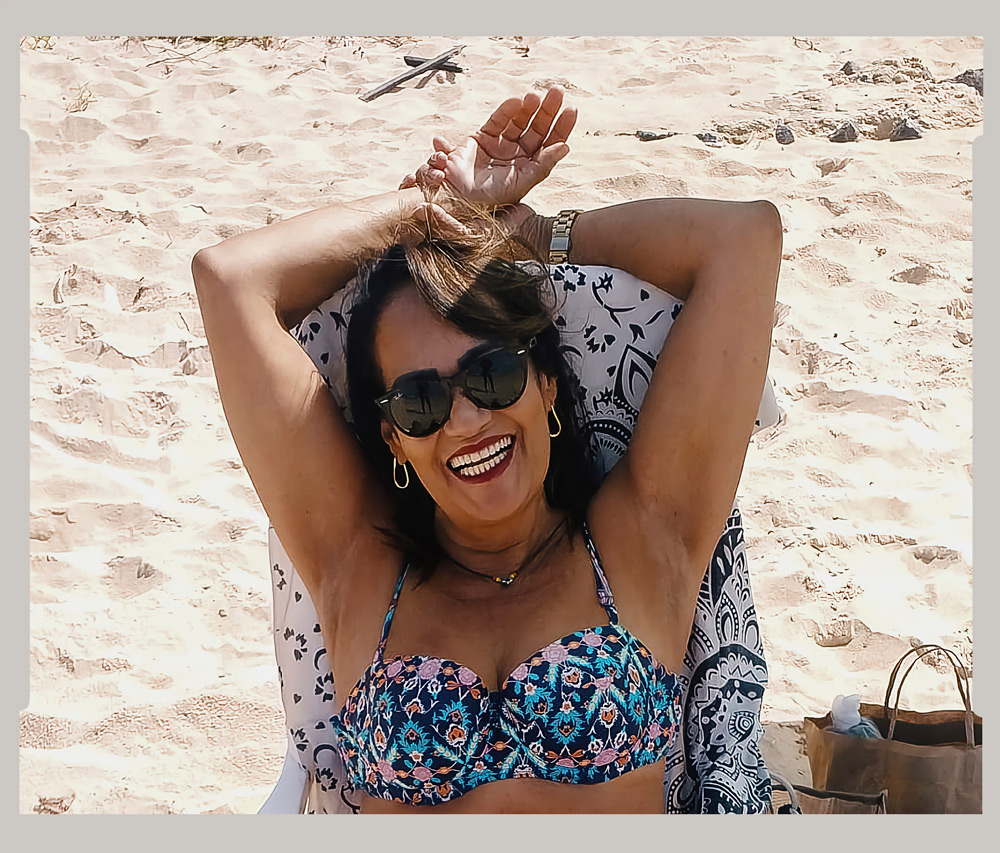 Shelia enjoying the sunny weather at a beach near her home