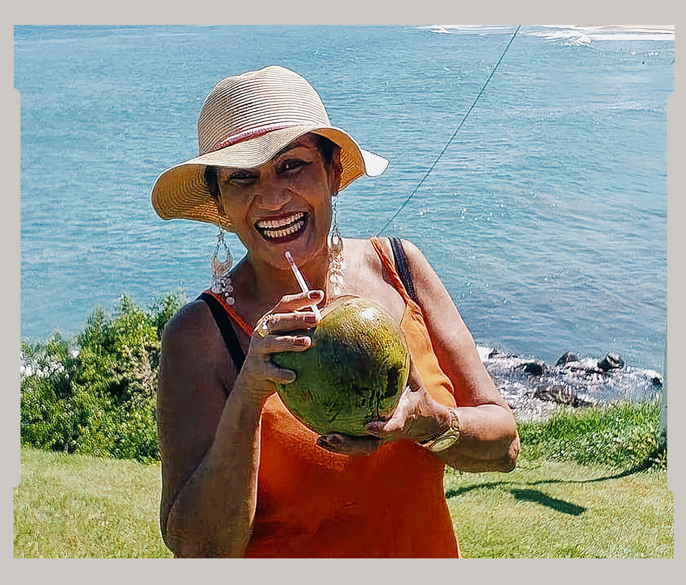 Shelia drinking coconut water after a walk