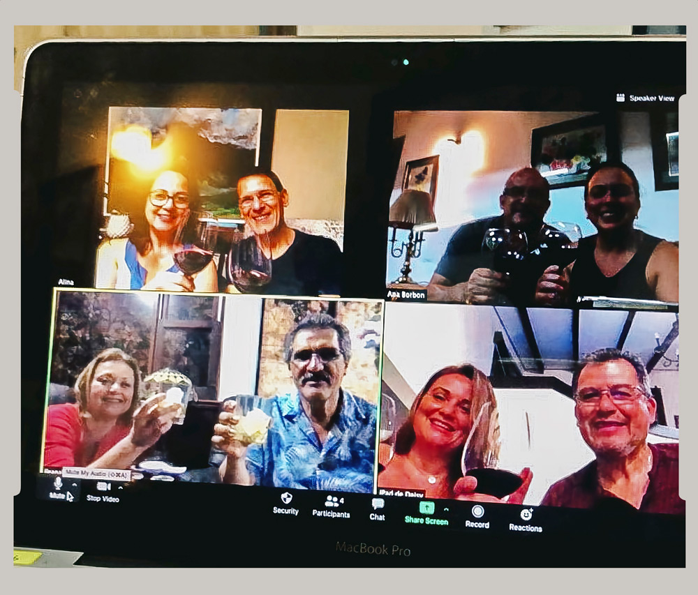 Gathering with family via Zoom for a virtual happy hour