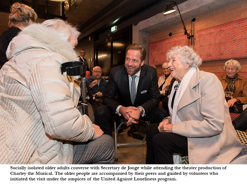 Secretary de Jonge converses with older adults while attending the theatre under the auspices of the United Against Loneliness program