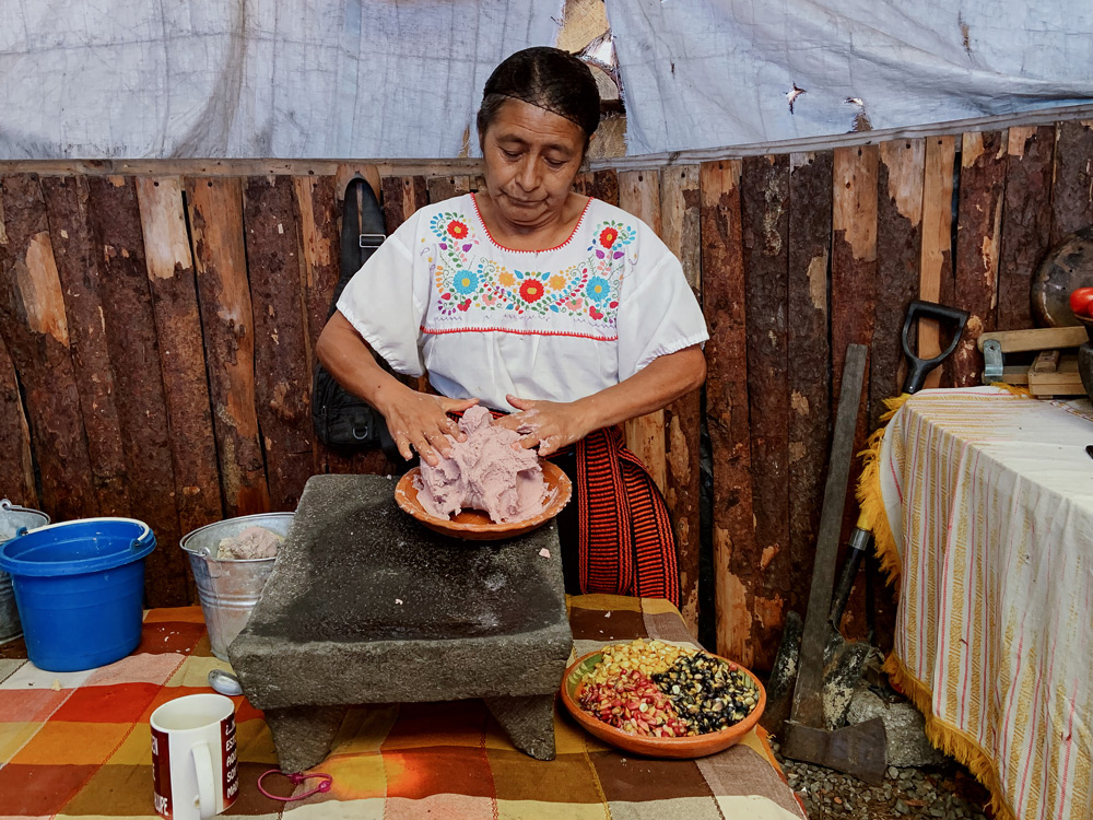 Nicolasa Hernández Muñoz, 56, preparing masa, a dough made from ground corn, to be shaped into tortillas