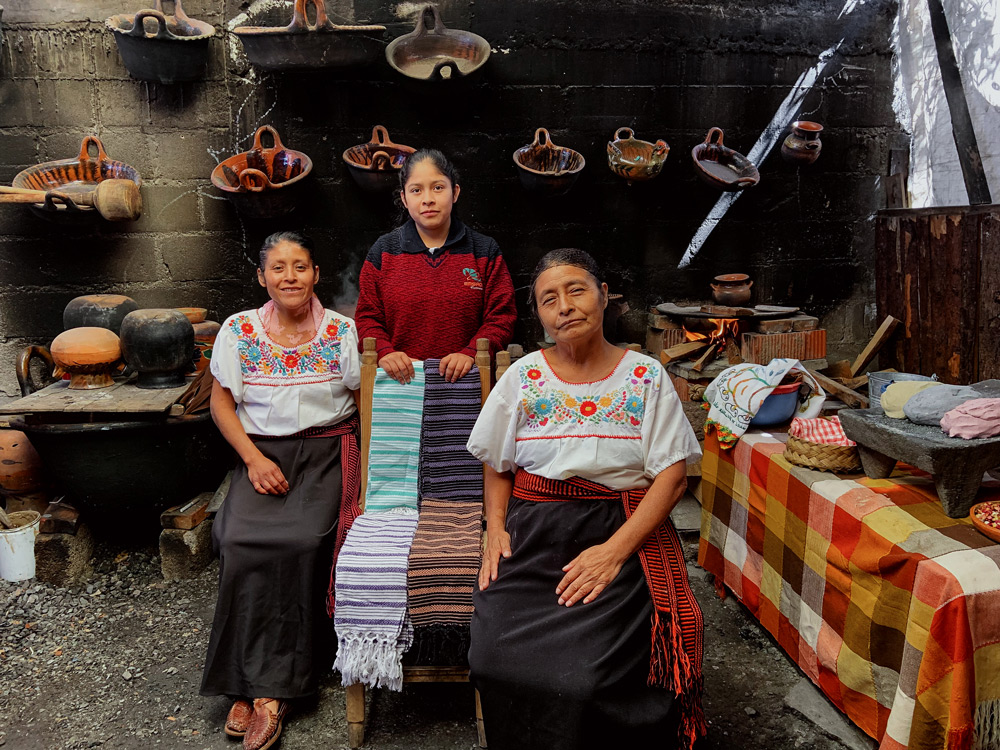 Dalia Rodríguez Hernández, 37, with her daughter Fatima, 15, and mother Nicolasa in their kitchen in Tlaxcala, Mexico